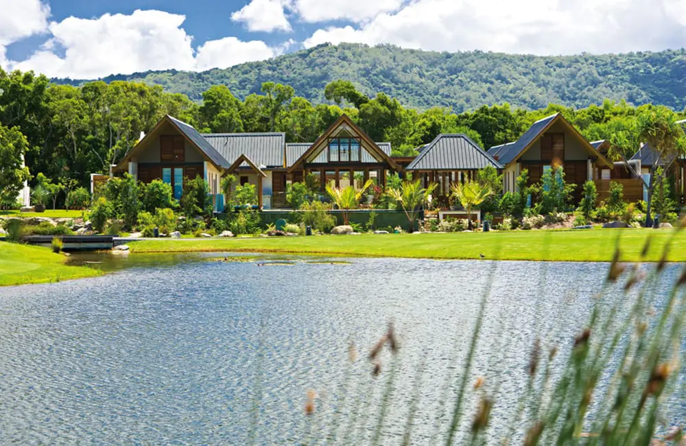 The surprising Aussie destination that brings 'White Lotus' vibes minus the price tag 3 Niramaya Villas & Spa in Port Douglas with lake in foreground – The White Lotus