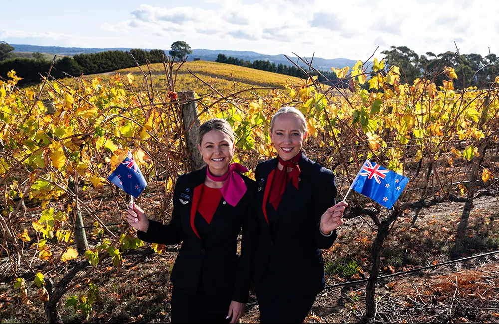 Karryon Top 10 stories of the week: Catch up on our most-wanted: May 23 8 Two Qantas female cabin crew with Australian and NZ flags at The Lane Vineyard in Hahndorf, South Australia
