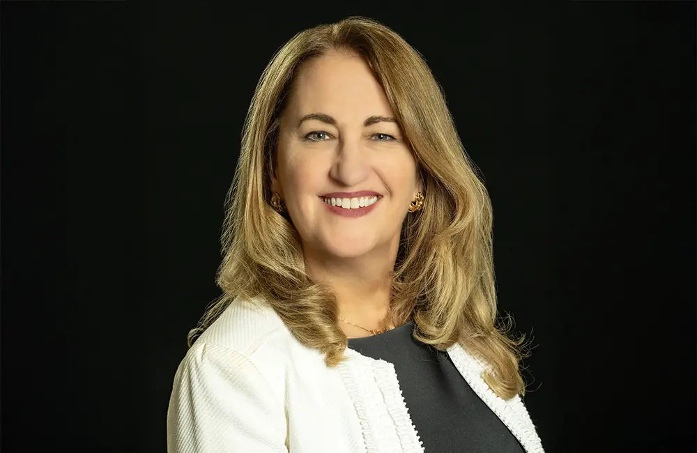 Movers + Shakers: Virtuoso promotes Lori Sheller to lead its cruise division 1 Corporate headshot of blonde woman against black background.