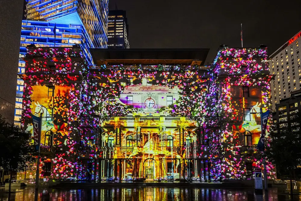 Vivid Sydney 2025: Lights on for 15th anniversary amid weather woes 2 VividSydney_2025_CircularQuay_HouseofRomanceDreamsCollide_CREDITDestinationNSW_KM-88088