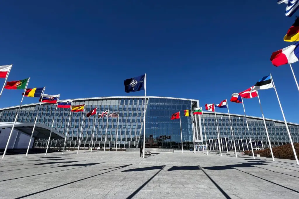 DFAT gives new travel advice level for popular western European nation 3 The national flags of countries member of the NATO fly outside the organisation headquarters in Brussels, Belgium on April 3, 2023.