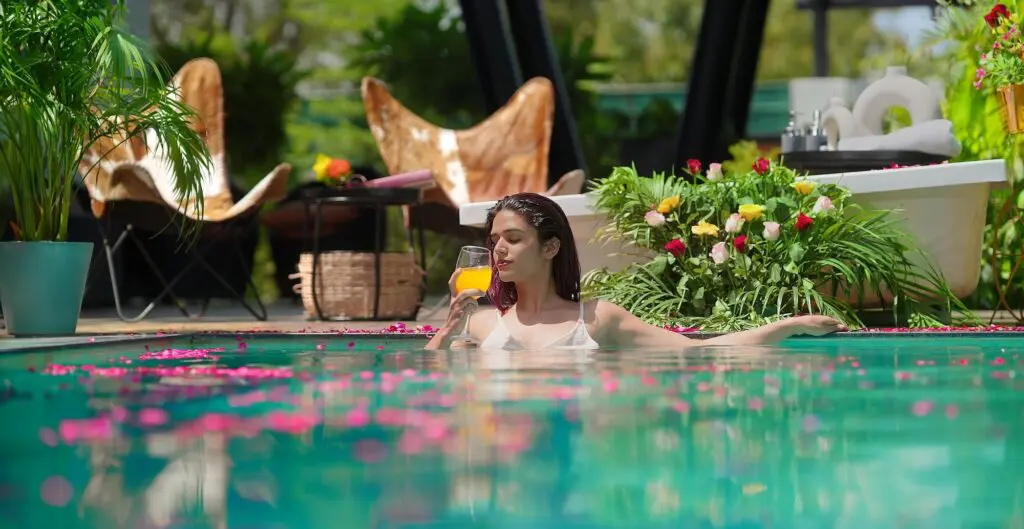 Karryon Top 10 stories of the week: Catch up on our most-wanted: May 9 10 Indian beautiful woman standing in swimming pool edge hold glass drinking juice at outdoor home. Happy female bathing in luxury resort hotel doing relaxation pose in blue water enjoy summer vacation