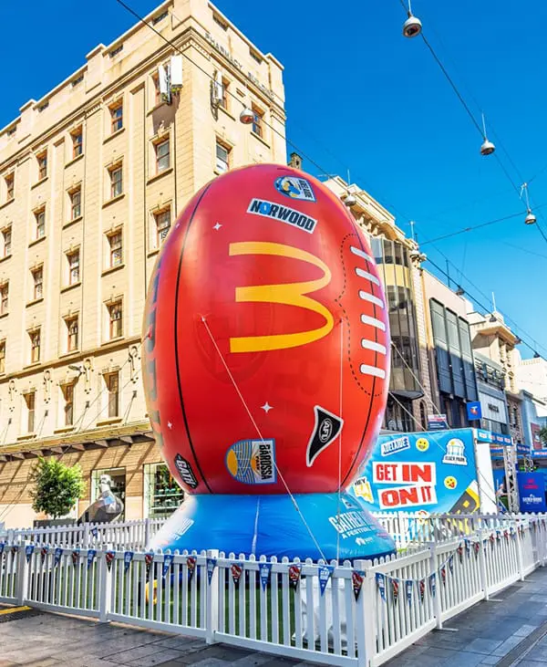 This surprising Australian capital city leads rise in corporate travel spend, Flight Centre division reveals 4 Inflatable football in Adelaide's Rundle Mall to promote the AFL Gather Round in April 2025. Image: Adam Calaitzis/Shutterstock