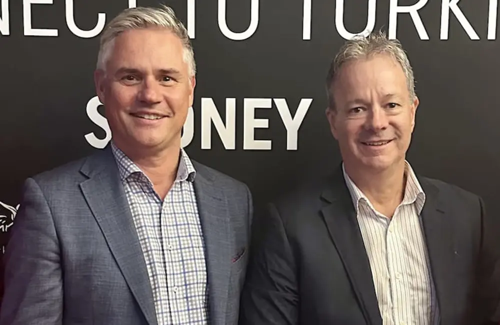 CATO Chair Dennis Bunnik & MD Brett Jardine against a branded backdrop.