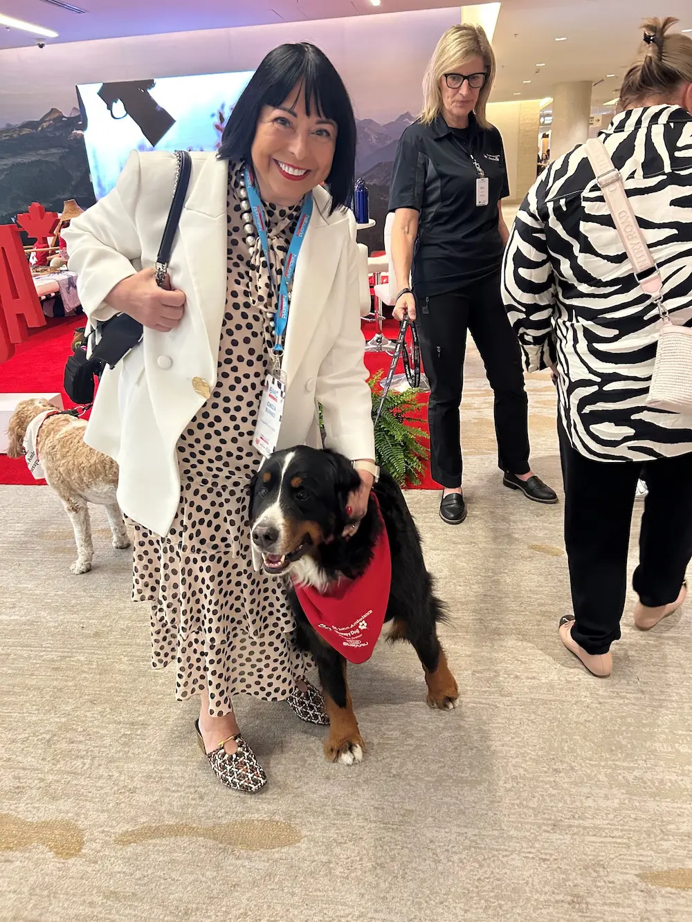 Helloworld OMC 2025 wraps in Vancouver with big energy & bigger takeaways 6 Cinzia Burnes with one of Vancouver Airport's therapy dogs.