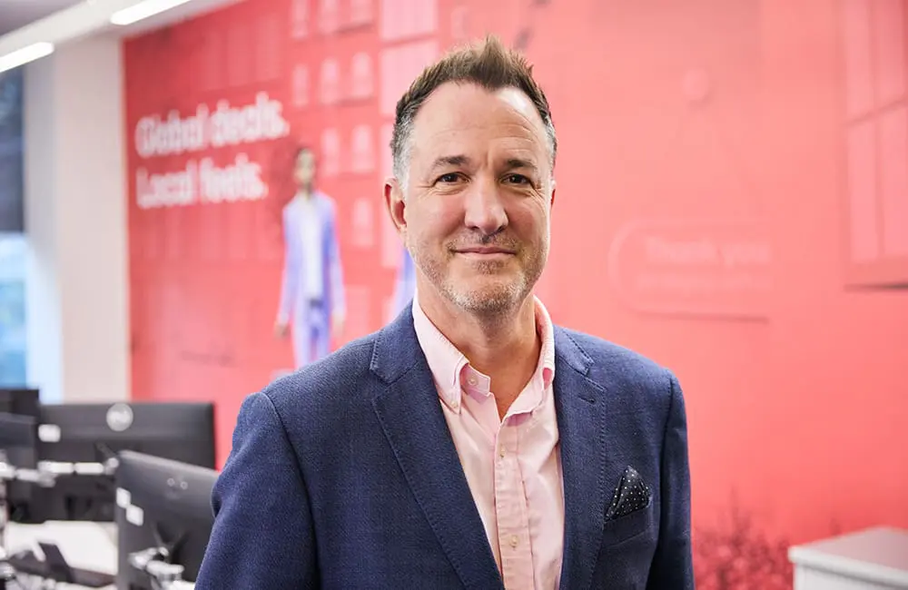This surprising Australian capital city leads rise in corporate travel spend, Flight Centre division reveals 3 Corporate Traveller Global Managing Director Tom Walley headshot in office – corporate travel spend insights.