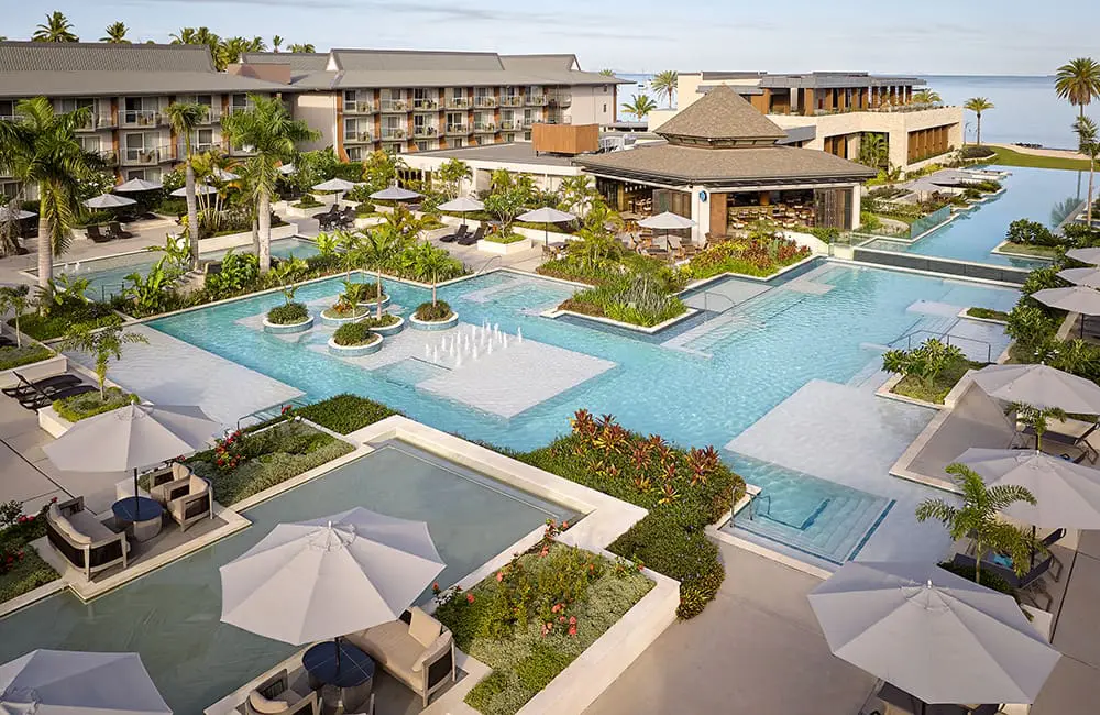 Movers + Shakers: Crowne Plaza Fiji Nadi Bay Resort & Spa adds new GM Sudhir Yadav 1 Drone image of Crowne Plaza Fiji Nadi Bay Resort & Spa pool area.