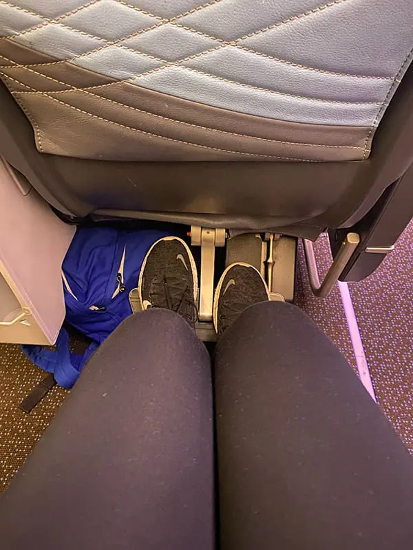 Flight Test: Singapore Airlines – Brisbane to Brussels on a mixed-class ticket 5 The legroom in Premium Economy as demonstrated by someone of average height. Image: Cassie Tannenberg