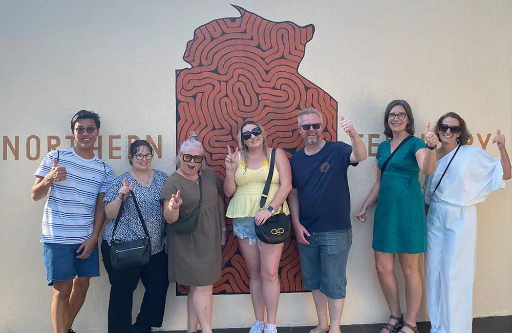 NT rolls out first-ever Aboriginal Tourism Product Awareness Program famil 5 The inaugural ATPAP famil group in Darwin with Northern Territory sign. Image: Tourism NT
