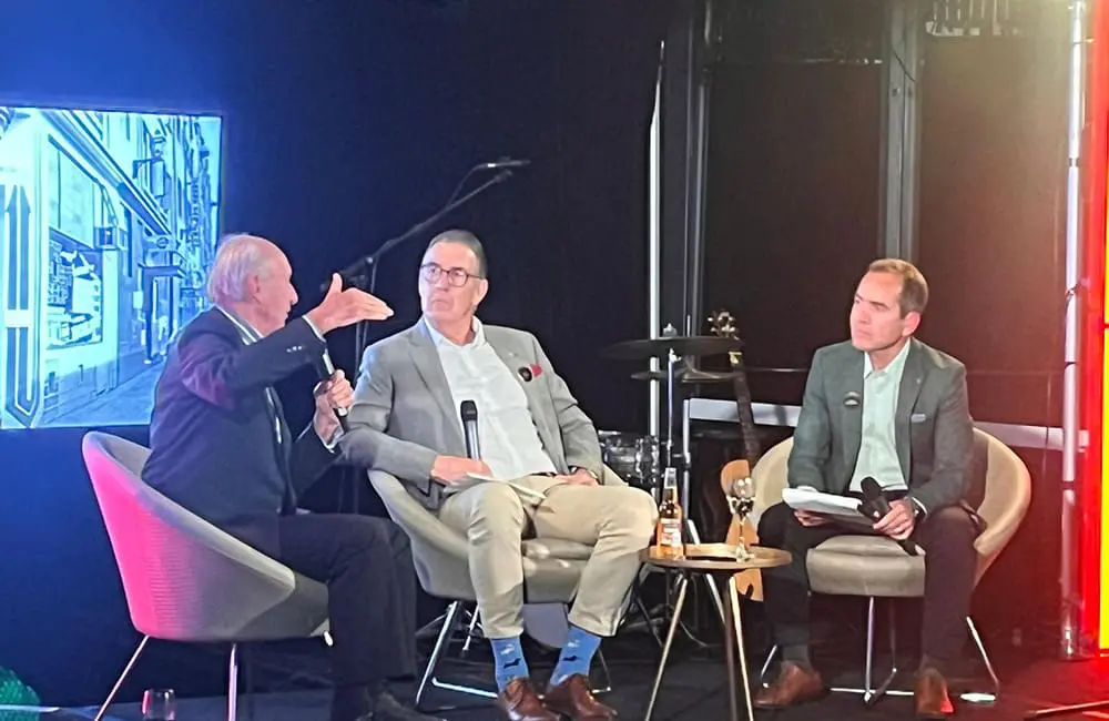 Giddy up! Flichella 2025 rides again with outback-themed EOFY Flight Centre event; Founders' Dinner 1 Flight Centre Travel Group CEO – Leisure James "JK" Kavanagh (at right) in conversation with Co-Founders Bill James and Geoff Harris at the Founders' Dinner.