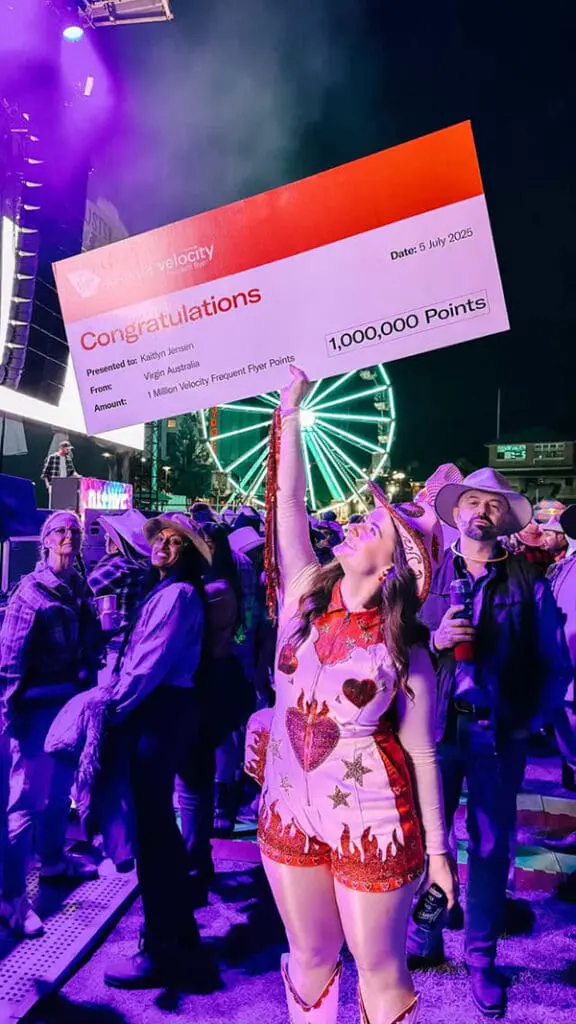 Giddy up! Flichella 2025 rides again with outback-themed EOFY Flight Centre event; Founders' Dinner 9 Flight Centre's Kaitlyn Jenner with her 1M Velocity Frequent Flyer Points cheque.