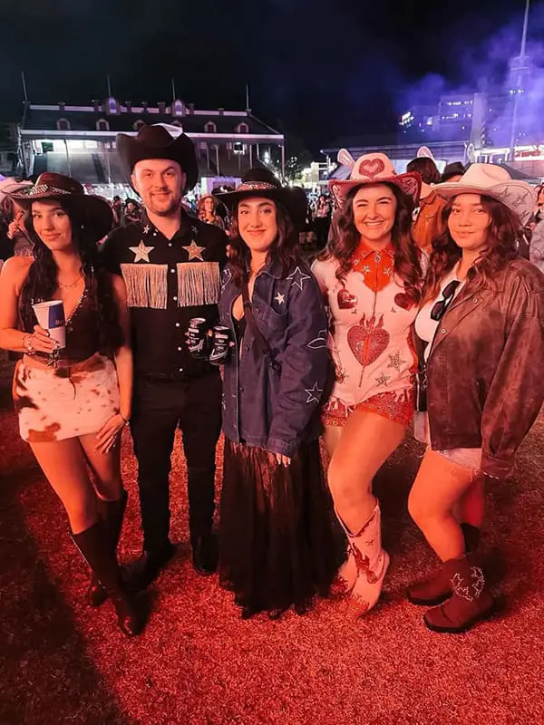 Giddy up! Flichella 2025 rides again with outback-themed EOFY Flight Centre event; Founders' Dinner 3 Flight Centre team members in cowgirl/cowboy theme costumes at Flichella 2025.
