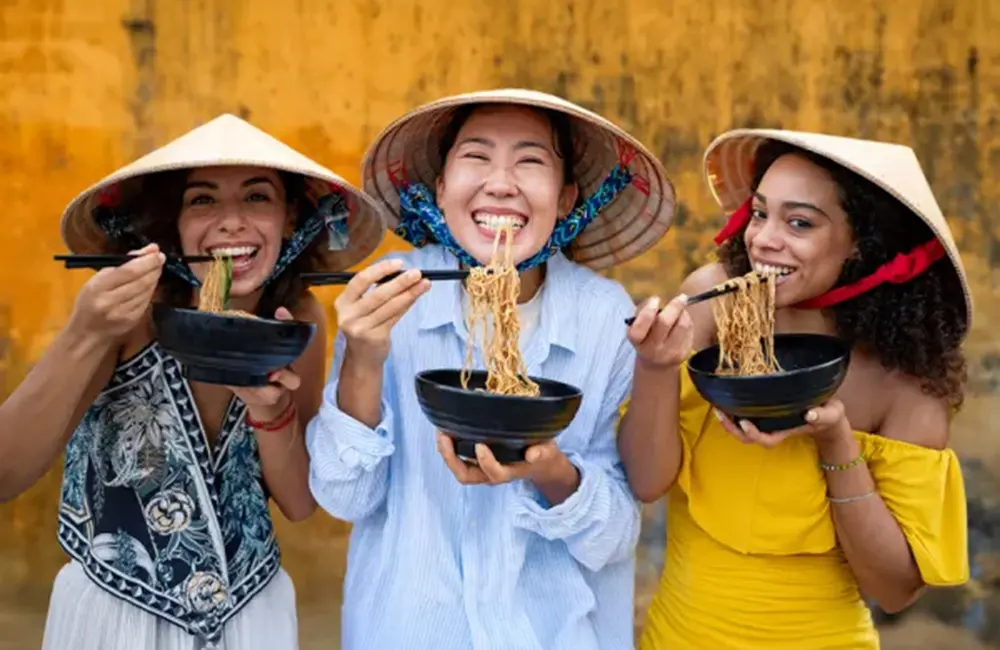 Karryon Top 10 stories of the week: Catch up on our most-wanted: Jul 11 3 Three women eating noodles against yellow background