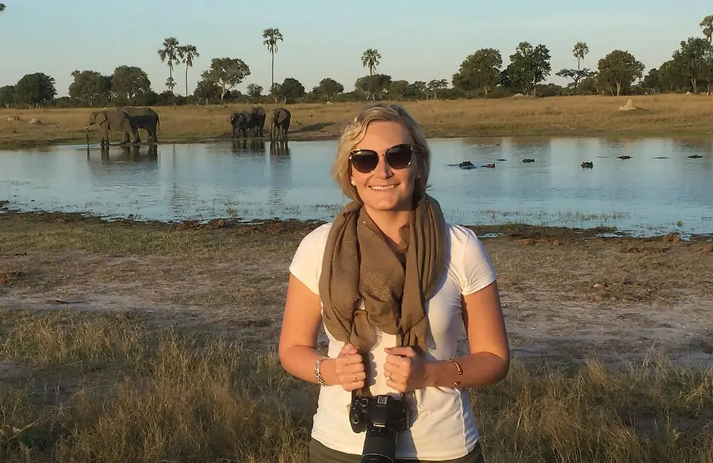 Movers + Shakers: Eclipse Travel elevates Hilary Dubyk as General Manager 1 Eclipse Travel GM Hilary Dubyk on location in Zimbabwe with elephants at waterhole.