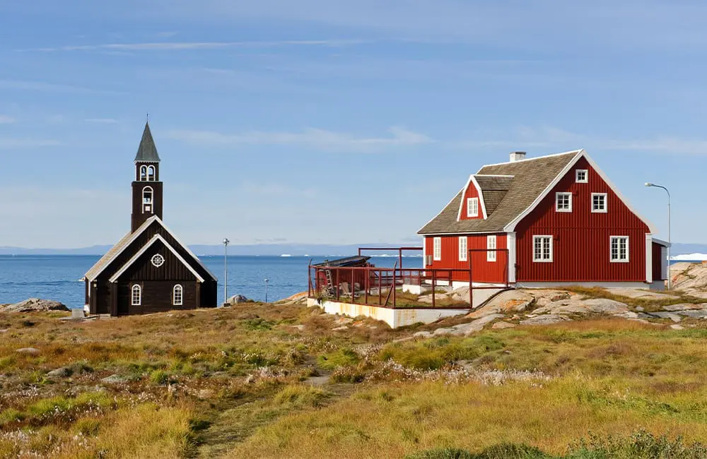 An antidote to overtourism: Hurtigruten’s Community-Centred ‘Open Village’ cruises 4 House and Church in Ilulissat Norway. Image: Thomas Haltner, Hurtigruten