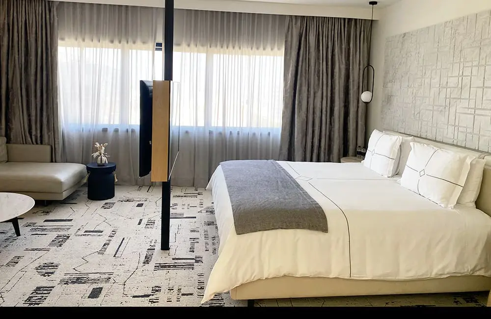 Hotel review: Relaxed luxury at The Huntley Santa Monica Beach, California, USA 3 Signature Suite bedroom and living area at The Huntley Santa Monica Beach. Image: Cassie Tannenberg