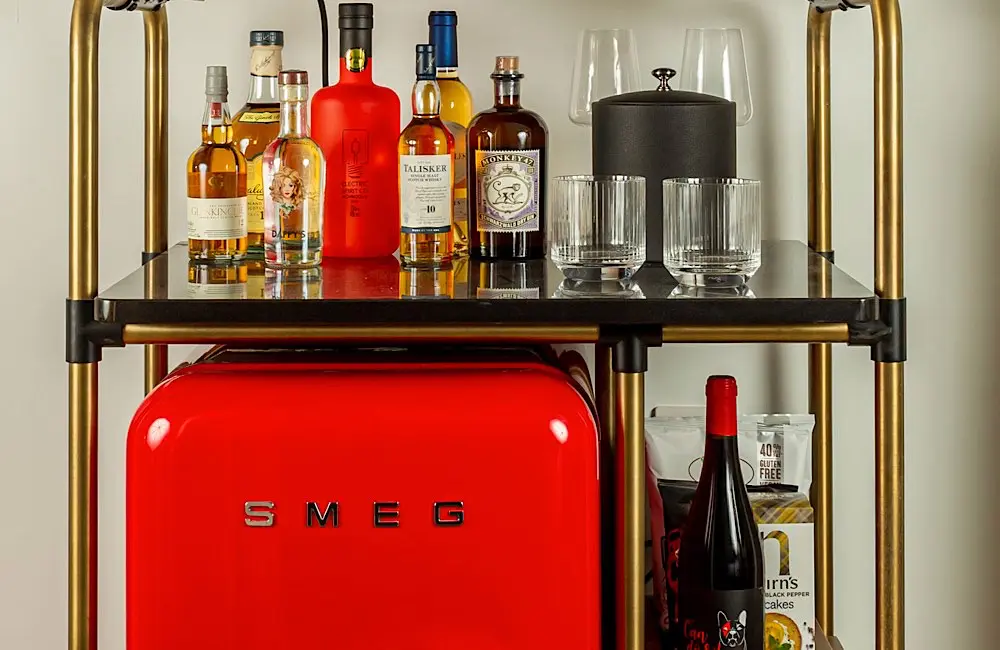 HOTEL REVIEW: Inside Virgin Hotels London, where staying in feels like going out 3 Fully stocked, dangerously photogenic, and Smeg-red for your attention—this minibar is ready to party before you are.