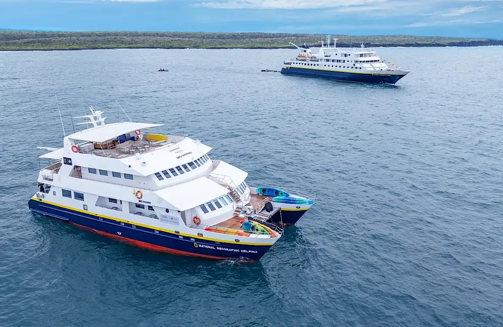 A different kind of launch: How a naming ceremony became a tribute to the Galápagos people 2 National Geographic Delfina and National Geographic Gemini in the heart of the Galápagos archipelago—Academy Bay.