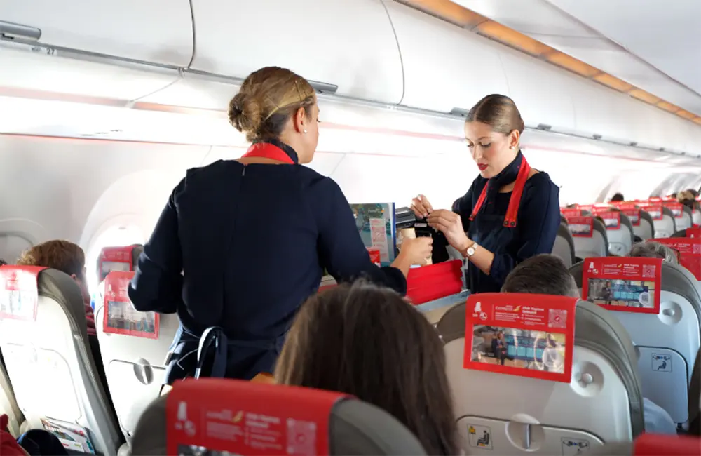 Sky-high happy hour: Which Aussie-bound budget airline serves the cheapest inflight booze? 3 Iberia Express crew onboard – global cheapest inflight booze service