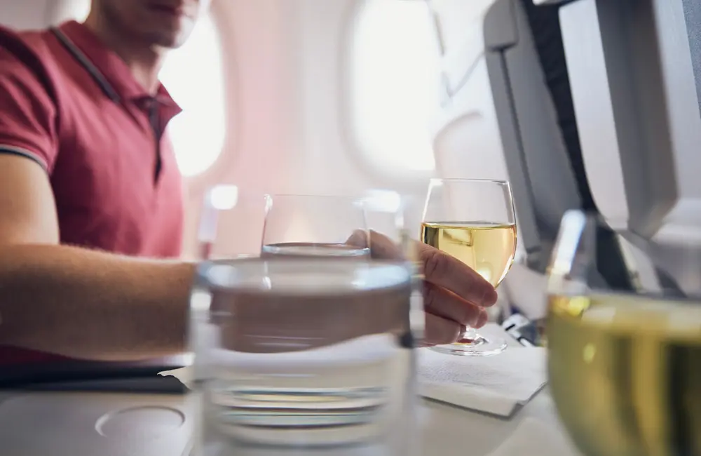 Sky-high happy hour: Which Aussie-bound budget airline serves the cheapest inflight booze?