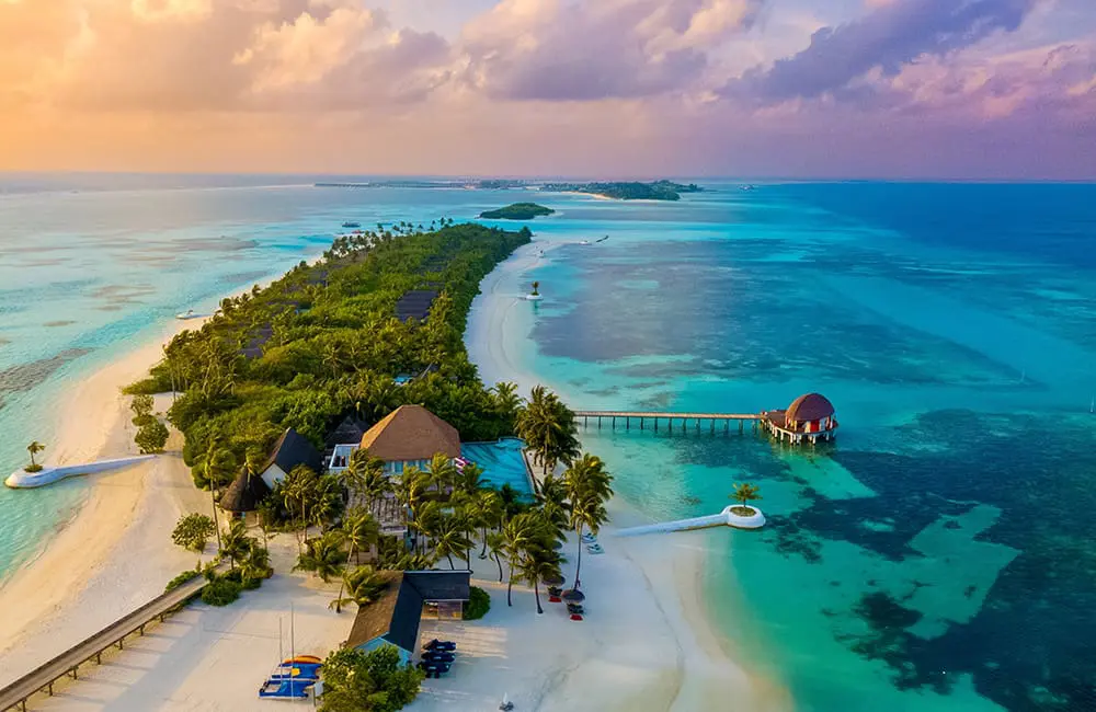 Beach-bound Aussies: Family travel surge forecast for Thailand & Bali this summer 2 Aerial image of Maldive resort. Image: Luxury Escapes