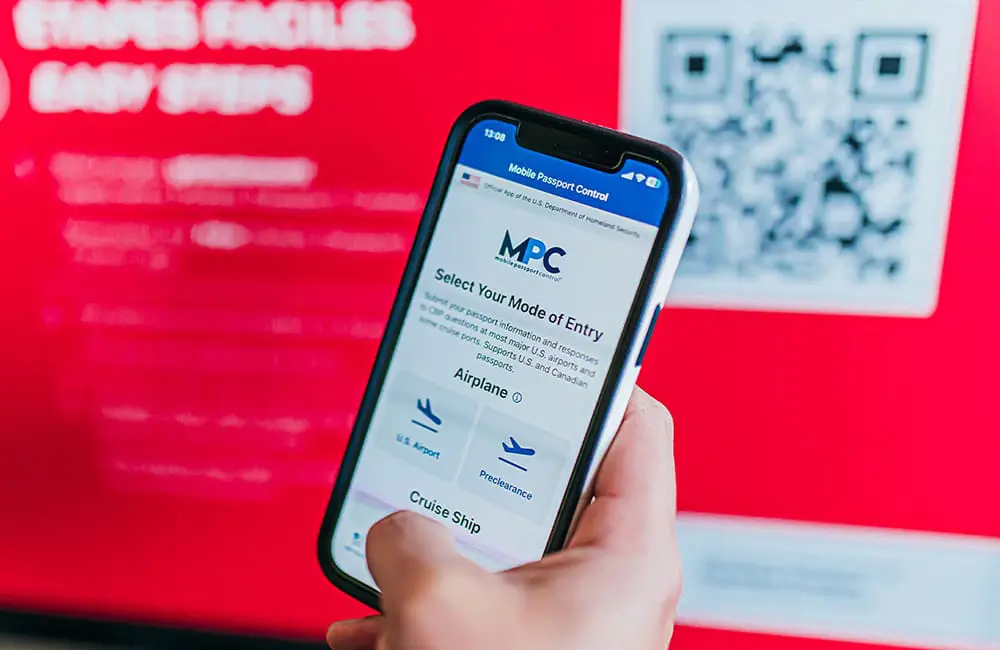 Open roads & borders: How to fast-track US entry plus new California road trips guide 2 The Mobile Passport Control app on a smartphone held in a hand.