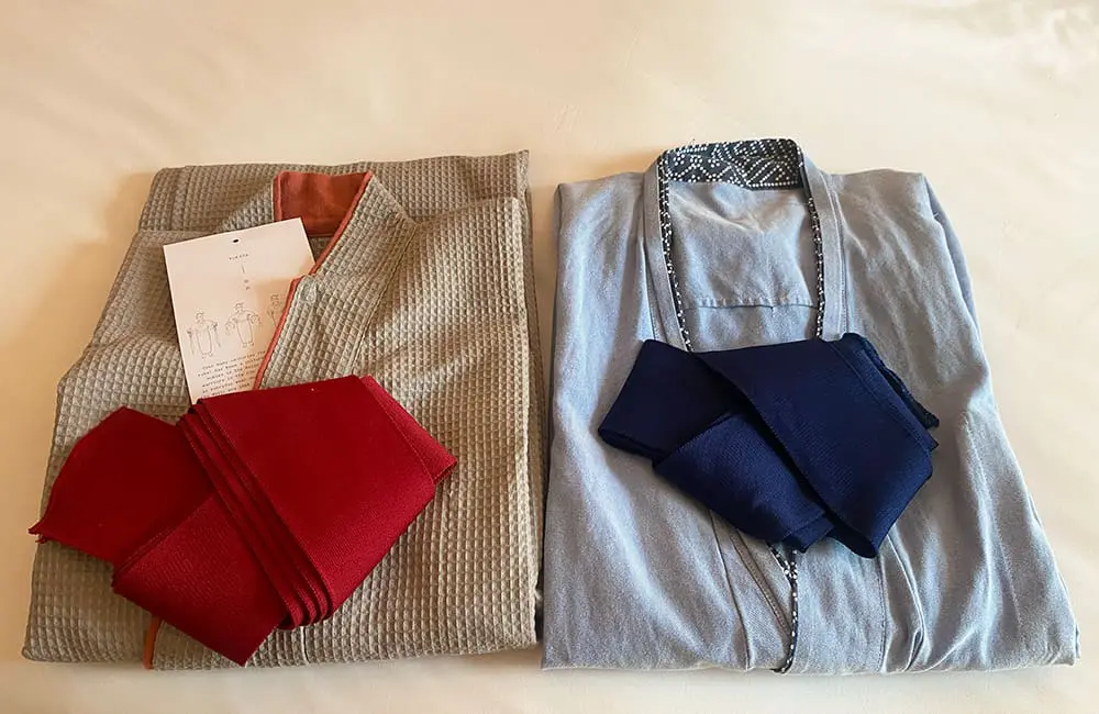 Hotel review: East meets West End at The Prince Akatoki, London, UK 11 Two folded Japanese yukatas with obi sashes on a hotel bed. Image: Cassie Tannenberg