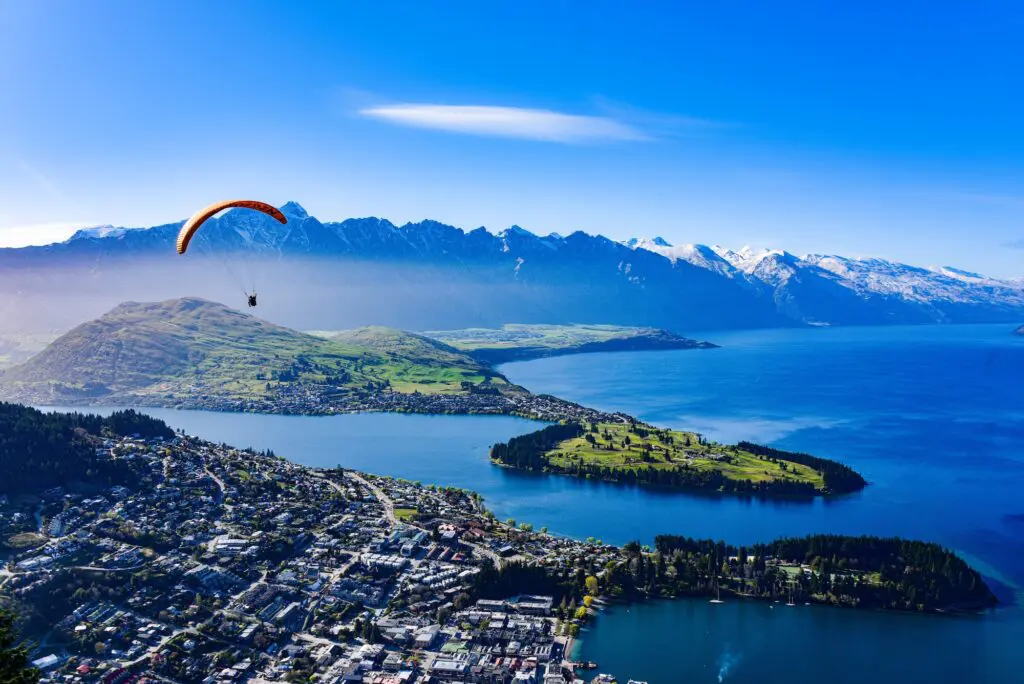 Destination Queenstown CEO Mat Woods interview: What Aussies love most about the resort town 3 Queenstown landscape with a tranquil, azure lake in New Zealand