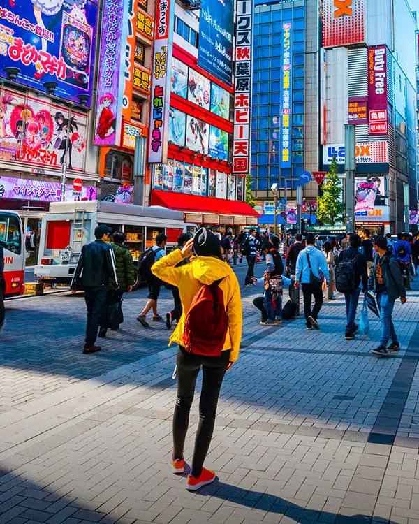 Exclusive: Flight Centre Global MD unpacks the future of its new FC-branded guided tour range 3 Traveller with back to camera in a Tokyo city street. Flight Centre Tours