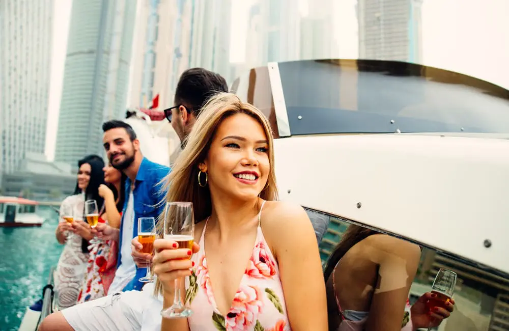 What Australian advisors can learn about US luxury trends from America’s largest travel company 5 Millennials on yacht in Dubai – US luxury travel trends. Image: Shutterstock