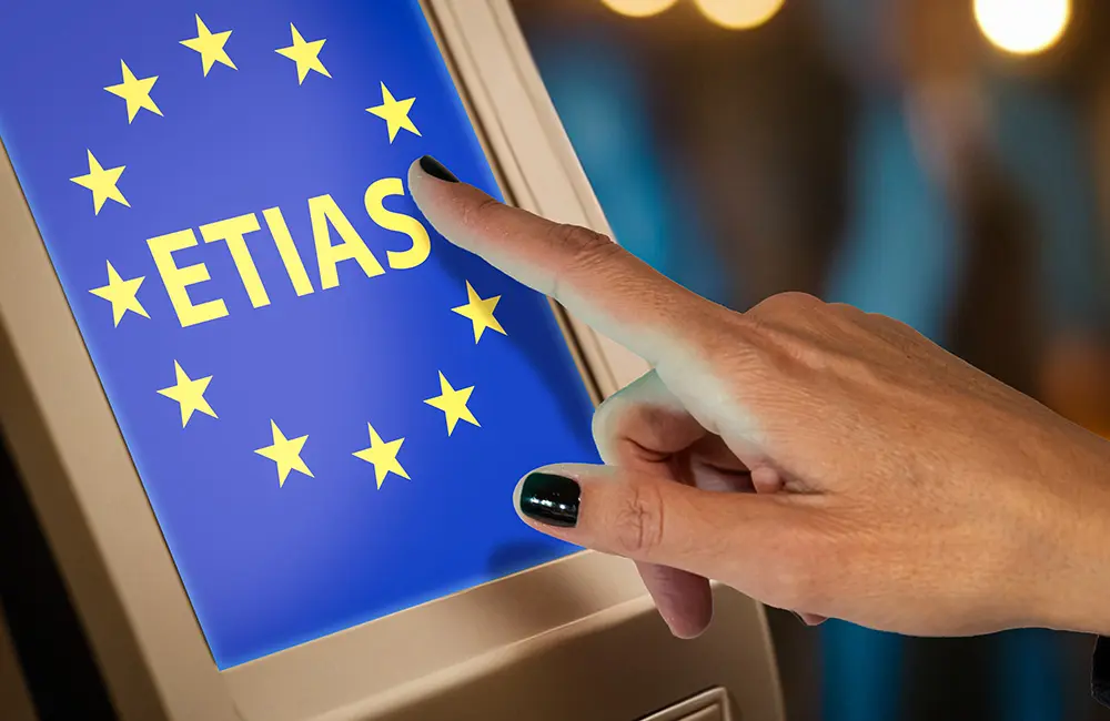 Europe's ETIAS entry fees triple – and it hasn't even launched yet 2 Close-up of hand on ETIAS screen – the European Union’s upcoming European Travel Information & Authorisation System