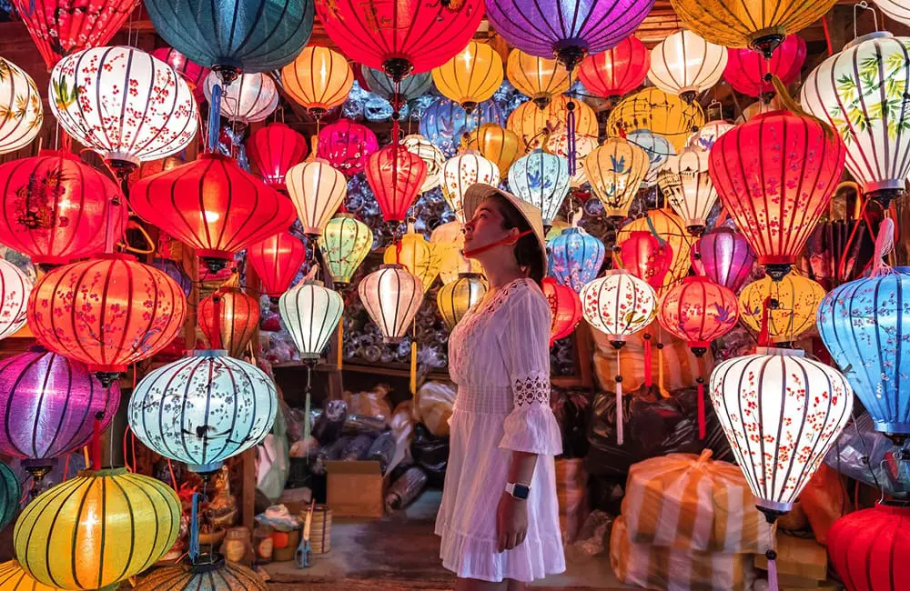 Exclusive: Flight Centre Global MD unpacks the future of its new FC-branded guided tour range 1 Female traveller in Vietnamese lantern shop. Flight Centre Tours