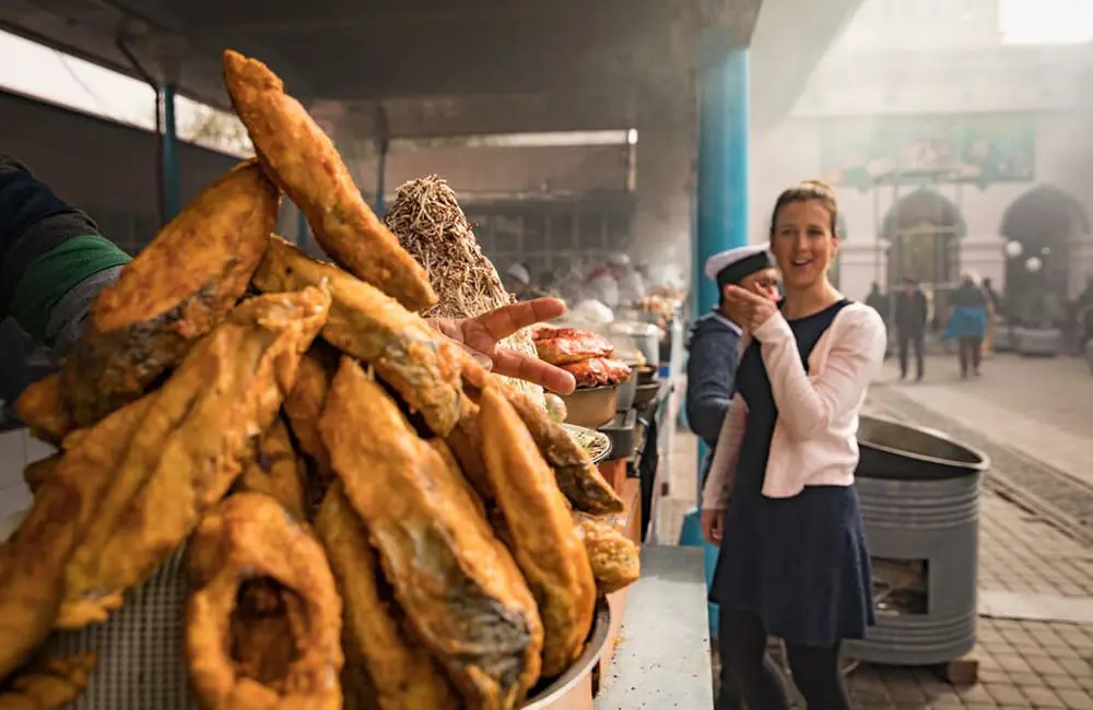 Intrepid Travel expands into Uzbekistan as Central Asia bookings surge by 70% 1 Female traveller at stall at Checking out Chorsu Bazaar in Tashkent, Uzbekistan. Image: Intrepid Travel