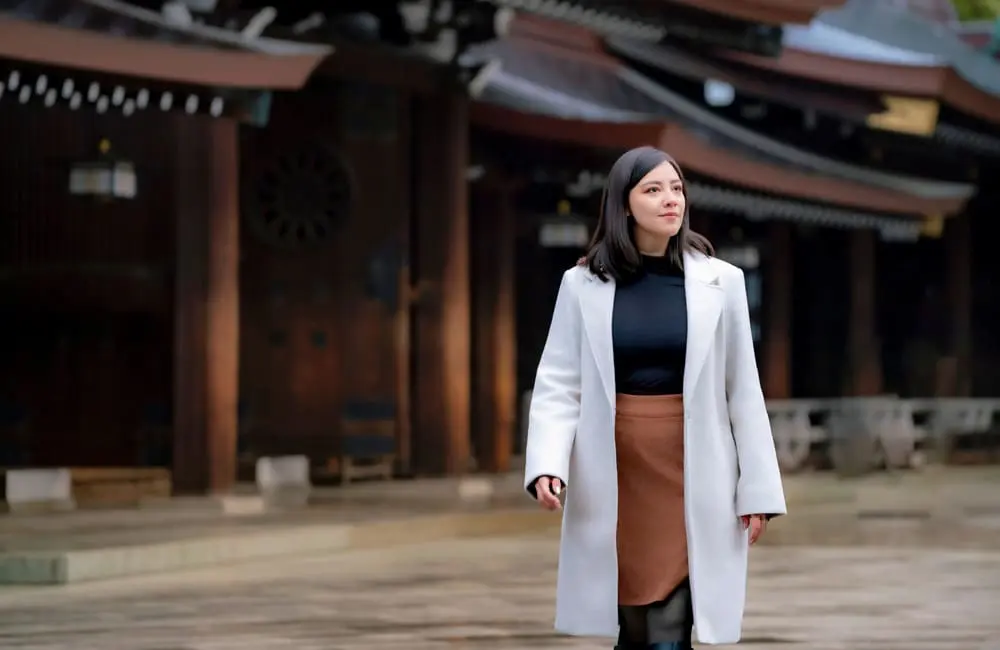 Female in business attire walking at Meiji Shrine in Tokyo, Japan – world's best workation cities. Image: Shutterstock