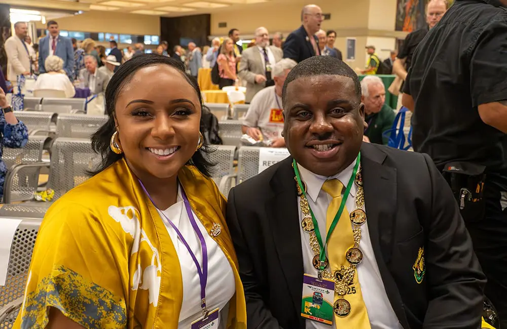 Carnival on track! Amtrak restores Mardi Gras Service between New Orleans & Mobile 5 Couple wearing Mardi Gras colours at station for relaunch of Amtrak Mardi Gras Service. Image: Larry Everage Jr