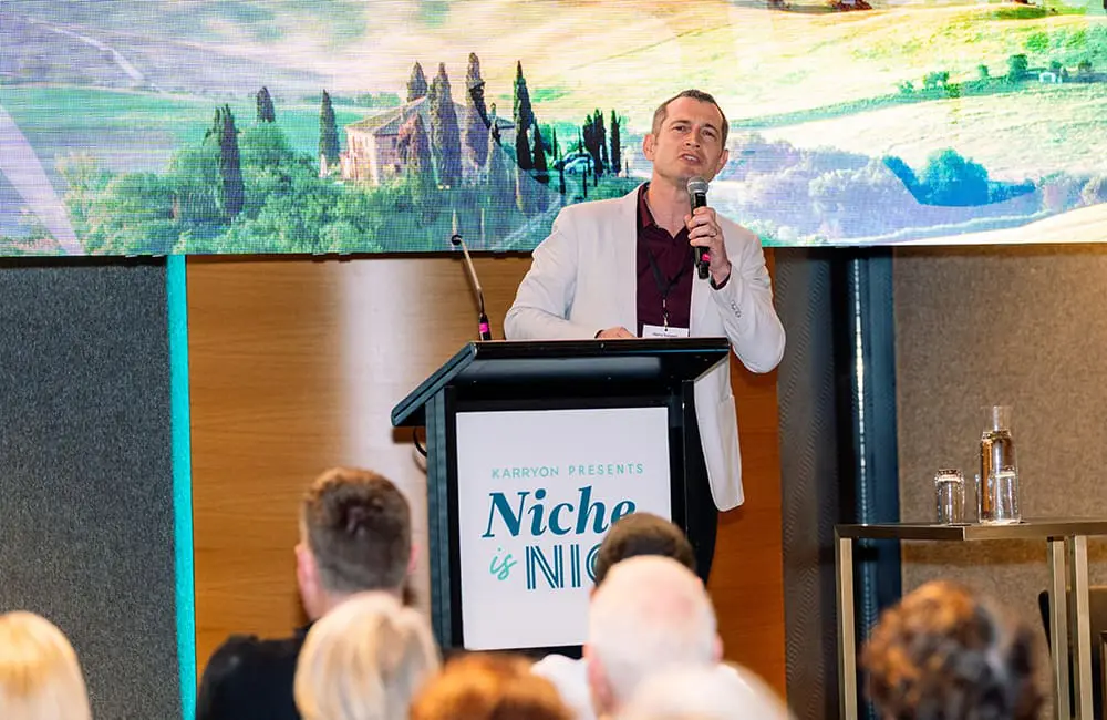 Brisbane sets the pace for Niche is Nice 2025 boutique travel roadshow 5 Albatross Tours' Harry Sargeant on stage at Niche is Nice 2025.