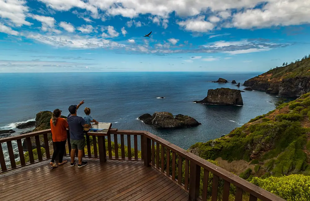 Family at lookout on Norfolk Island. Image: Norfolk Island Tourism – ETC for Omniche Holidays