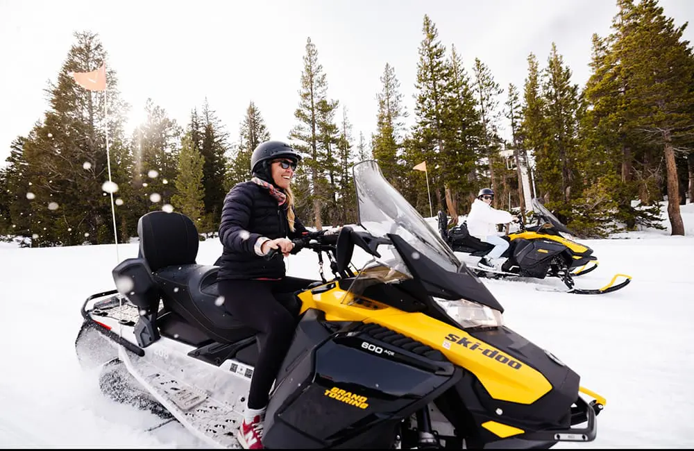 Snowmobiling in Mammoth Lakes – Accessibility Hub series. Image: Visit California