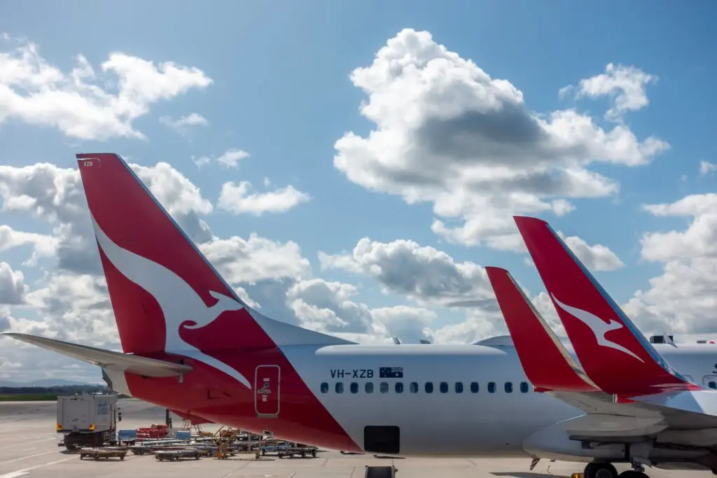 Qantas Group's profit jumps 15% to $2.2B; Jetstar shines with 55% profit surge 3 Qantas jets at Melbourne Airport.