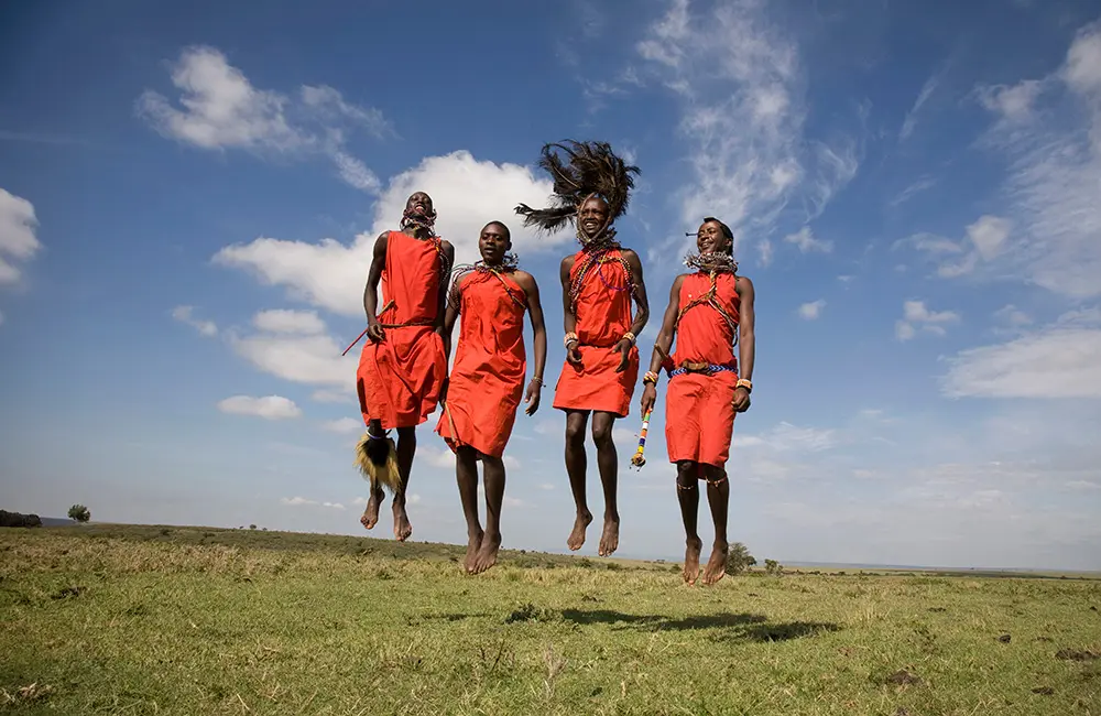 APT Travel Group records biggest bookings week ever, thanks to Europe, Canada & luxury demand 2 Maasai Mara warriors jumping in air for Travelmarvel tour in Kenya. APT Travel Group