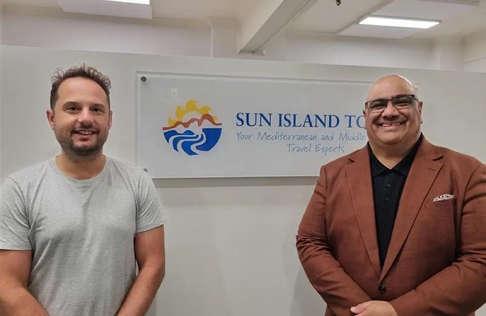John Polyviou, Joint CEO of Sun Island Tours, with Walter Nand at the company’s Sydney office.
