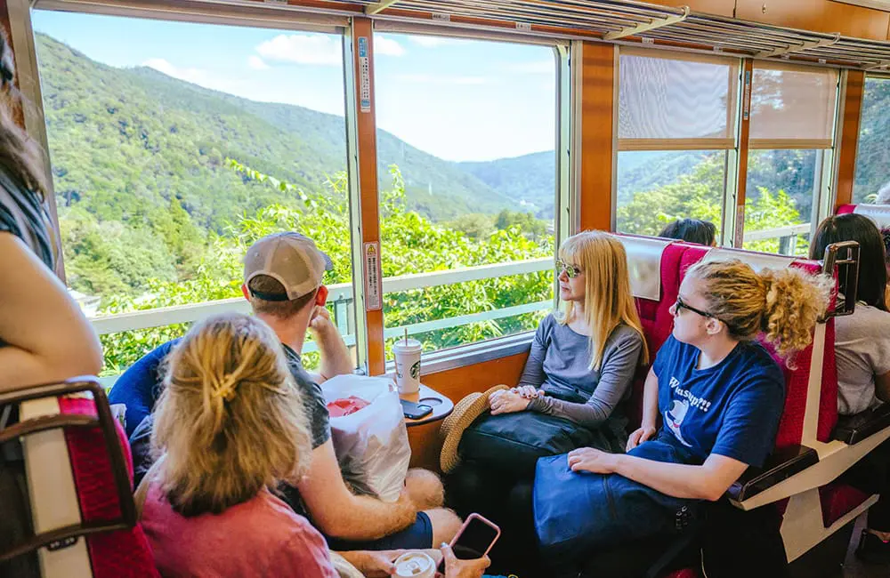 InsideJapan launches largest-ever small-group tour program for 2026 as interest hits record highs 4 InsideJapan group travelling on local train in Hakone.
