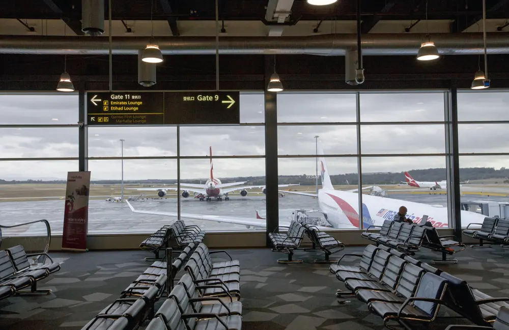 Qantas unlocks nonstop links to Australia’s most popular Asian destination with new codeshare 2 Qantas and Malaysia Airlines aircraft seen through window at Melbourne Airport.