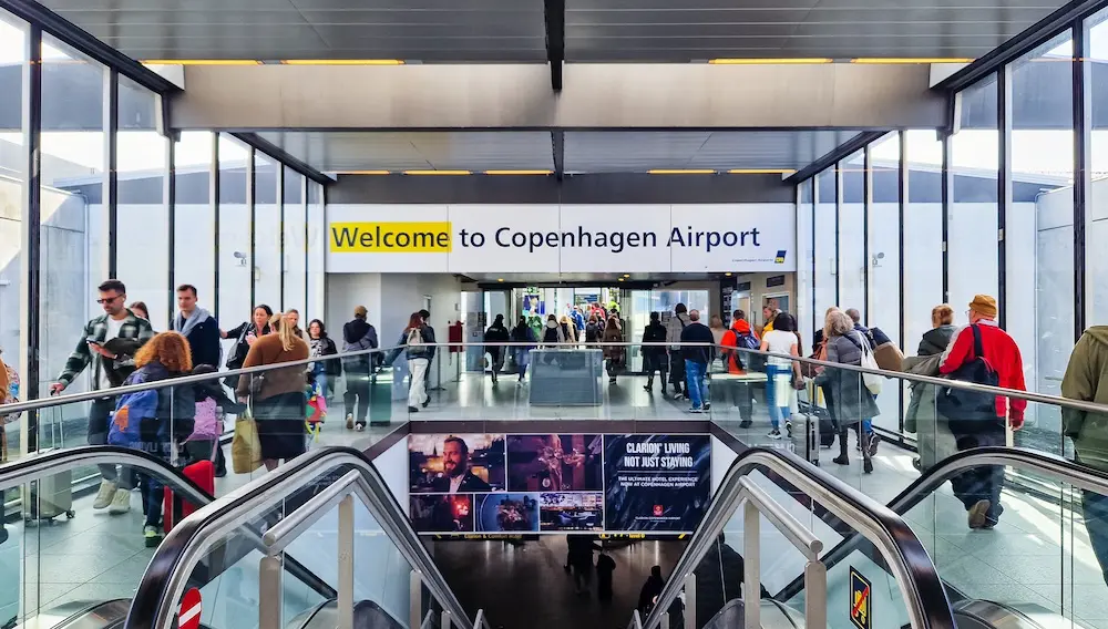 New way to enter and exit Europe starts on Sunday for Australian travellers 3 Copenhagen, Denmark - April 7, 2024: People walking inside Copenhagen airport. Copenhagen (Danish: Kobenhavn) Kastrup Airport CHP. AIRPORTS