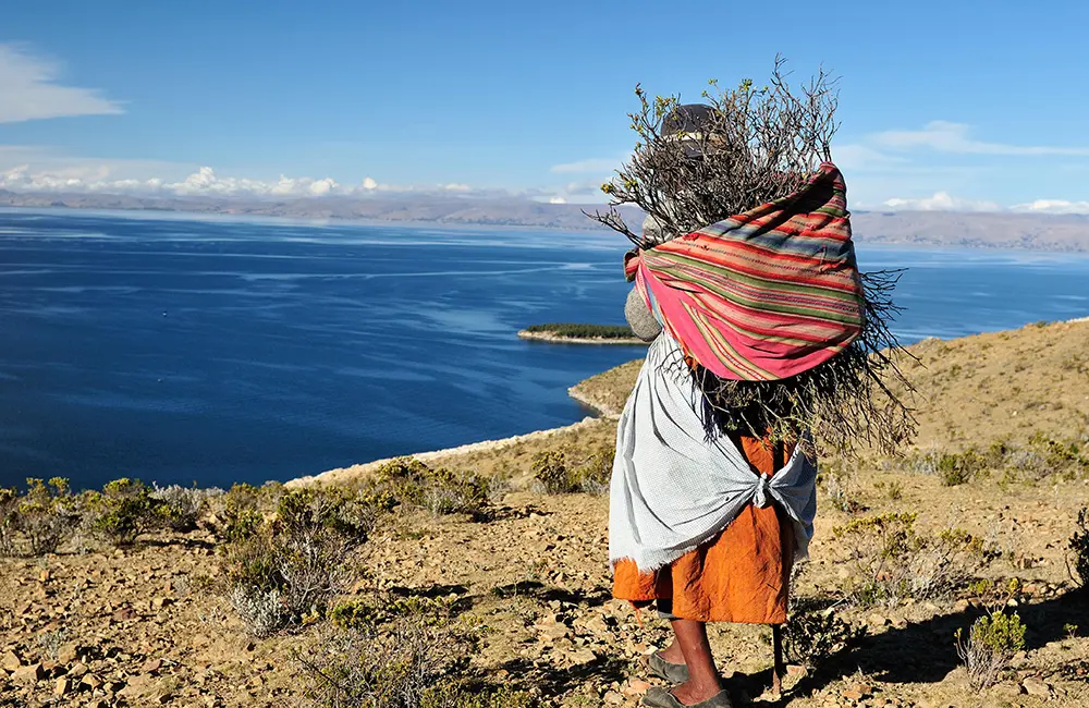 Karryon Top 10 stories of the week: Catch up on our most-wanted: Oct 10 9 Woman carrying basket at Lake Titicaca, Bolivia.