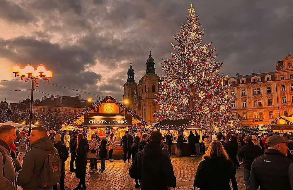 Yule love this: Albatross Tours unwraps Festive 2026 collection early for Christmas & NYE in Europe 2 Prague Christmas Market in the Old Town Square at dusk. Image: Emma-Marie Hughes