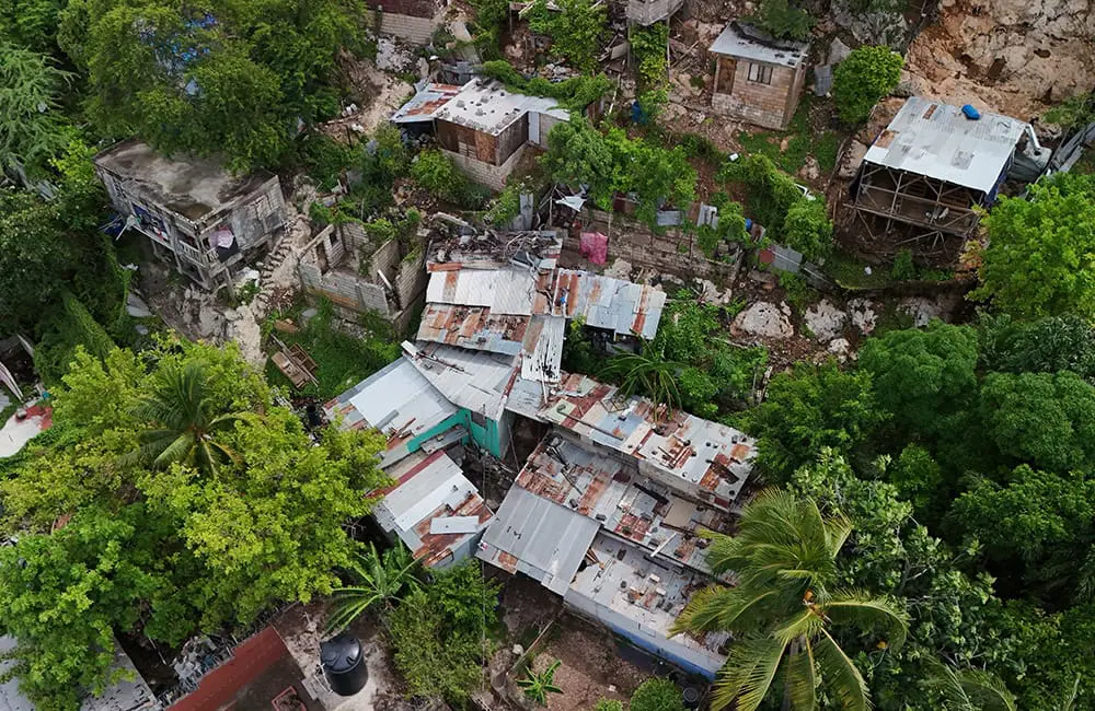 "Monster" Hurricane Melissa predicted to hit Jamaica for strongest storm in 174 years 2 Aerial image of building damage in Kingston, Jamaica from Hurricane Beryl in 2024. Image: Deron Levy/Shutterstock