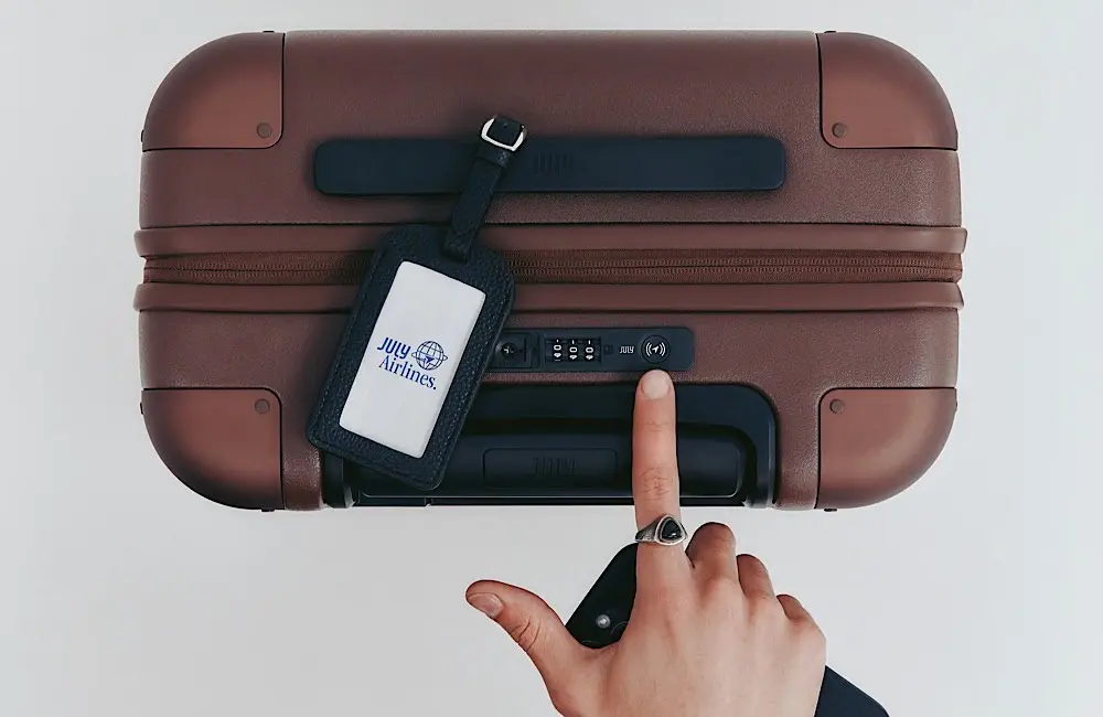 Never lose your luggage again: July unveils world-first smart suitcase with Apple and Google tech 2 A traveller activates the CaseSafe™ smart lock on a July suitcase.