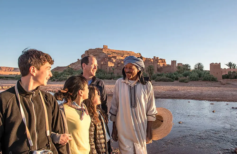 Trending travel styles: Intrepid ups family range and active adventures in 2026 with 38 new trips to meet demand 1 Family travelling with a local guide in the historic village of Aït Benhaddou in Morocco. Image: Intrepid Travel