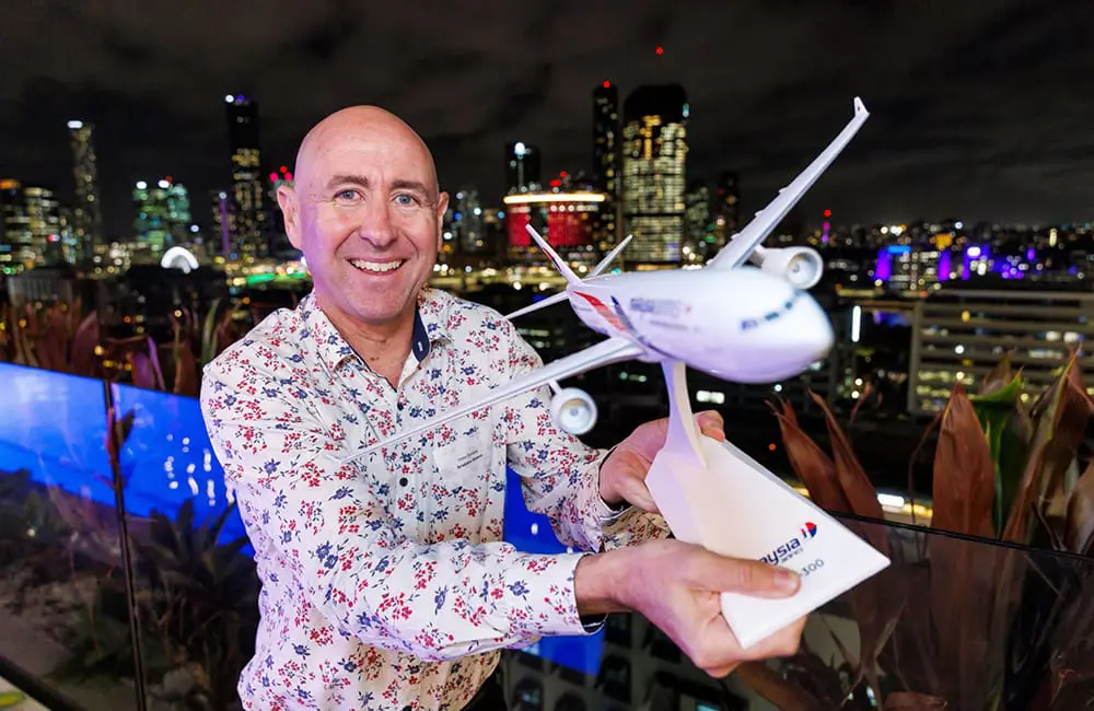 Relaunched flights & new connections: Brisbane Airport celebrates Malaysia Airlines' imminent return 7 BAC Media & Corporate Affairs Manager Peter Doherty with Malaysia Airlines model plane.